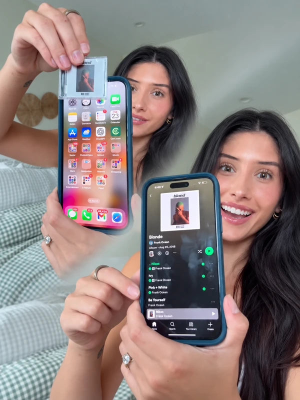Two women demonstrating Album Tags and music on their phones