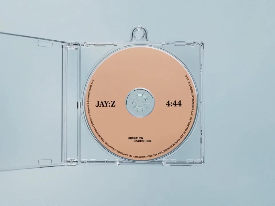 An Album Tag case and miniature disc rotate through front, back and inside views.