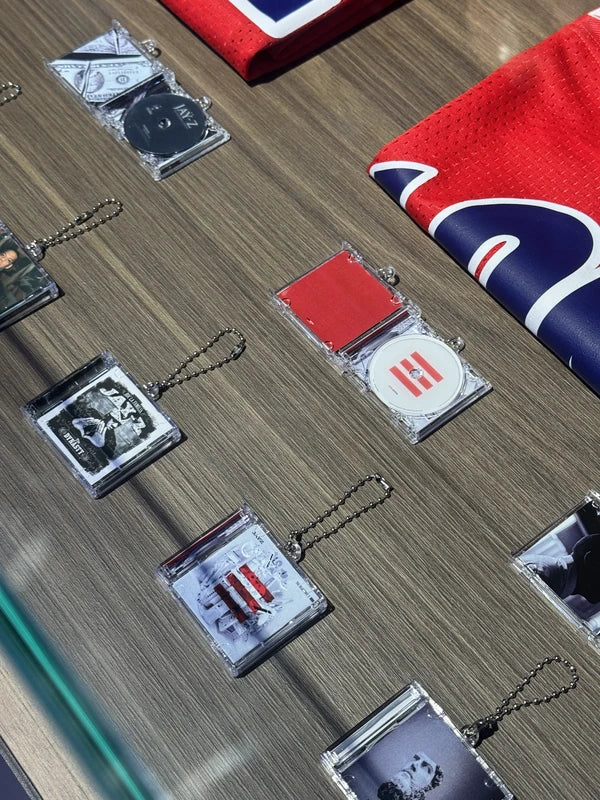 Album Tags and music merchandise arranged on a table